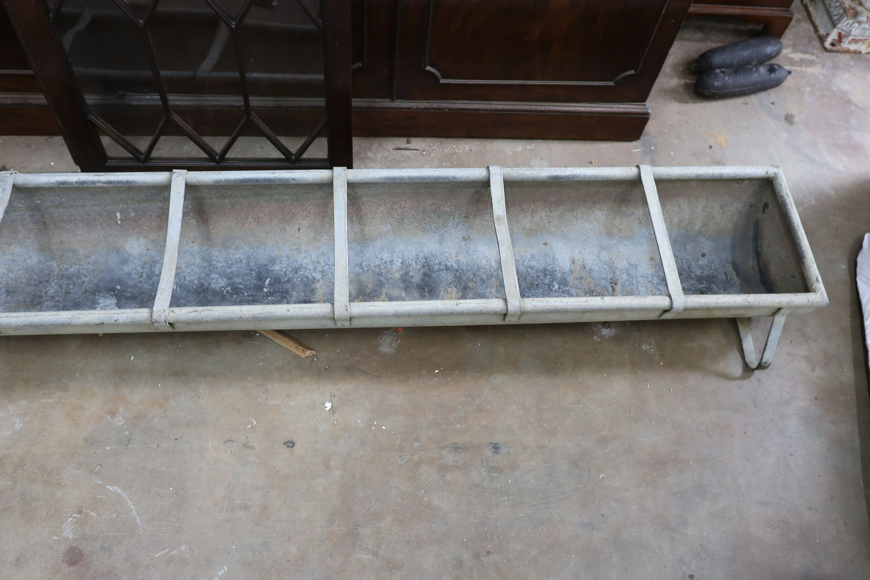 A large vintage galvanised water trough, length 246cm, depth 34cm, height 20cm